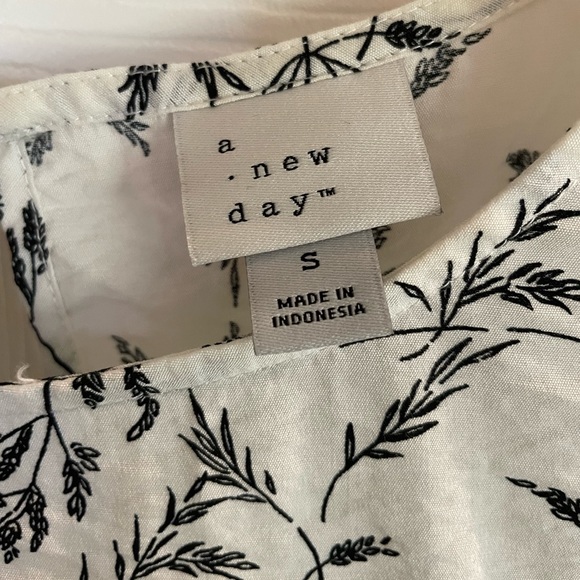 A New Day size small. White background with black print. - Picture 3 of 3